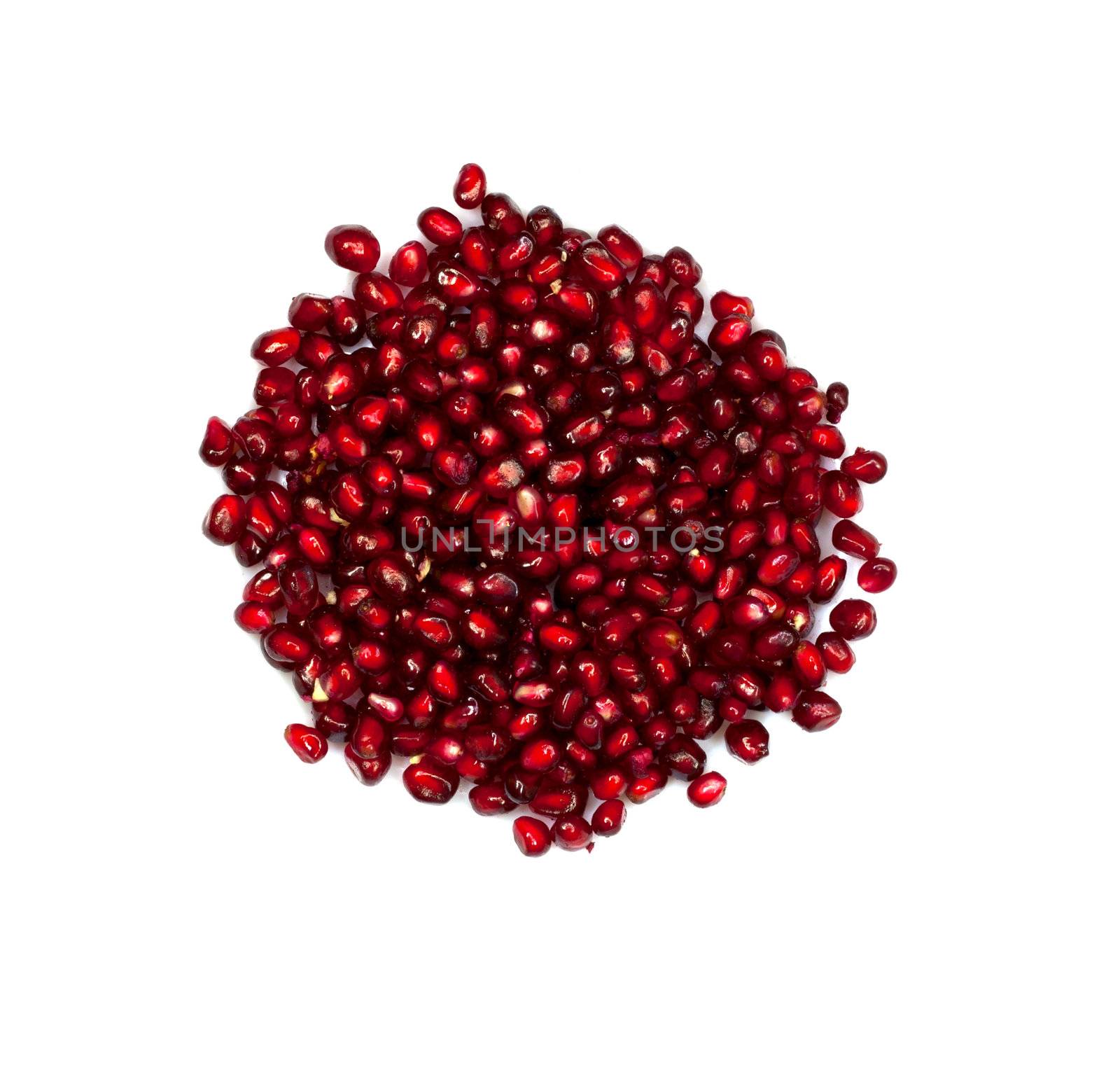 Extreme close up background of a red juicy ripe pomegranate fruit seeds 