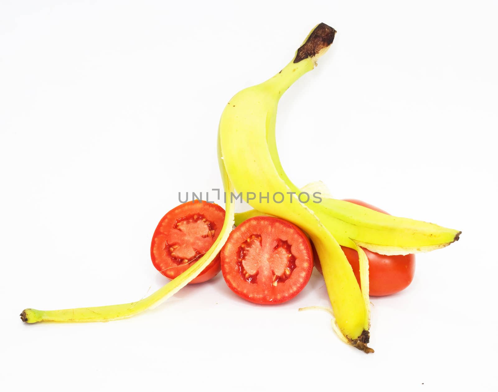 Banana skin and tomatoes insulated on white background