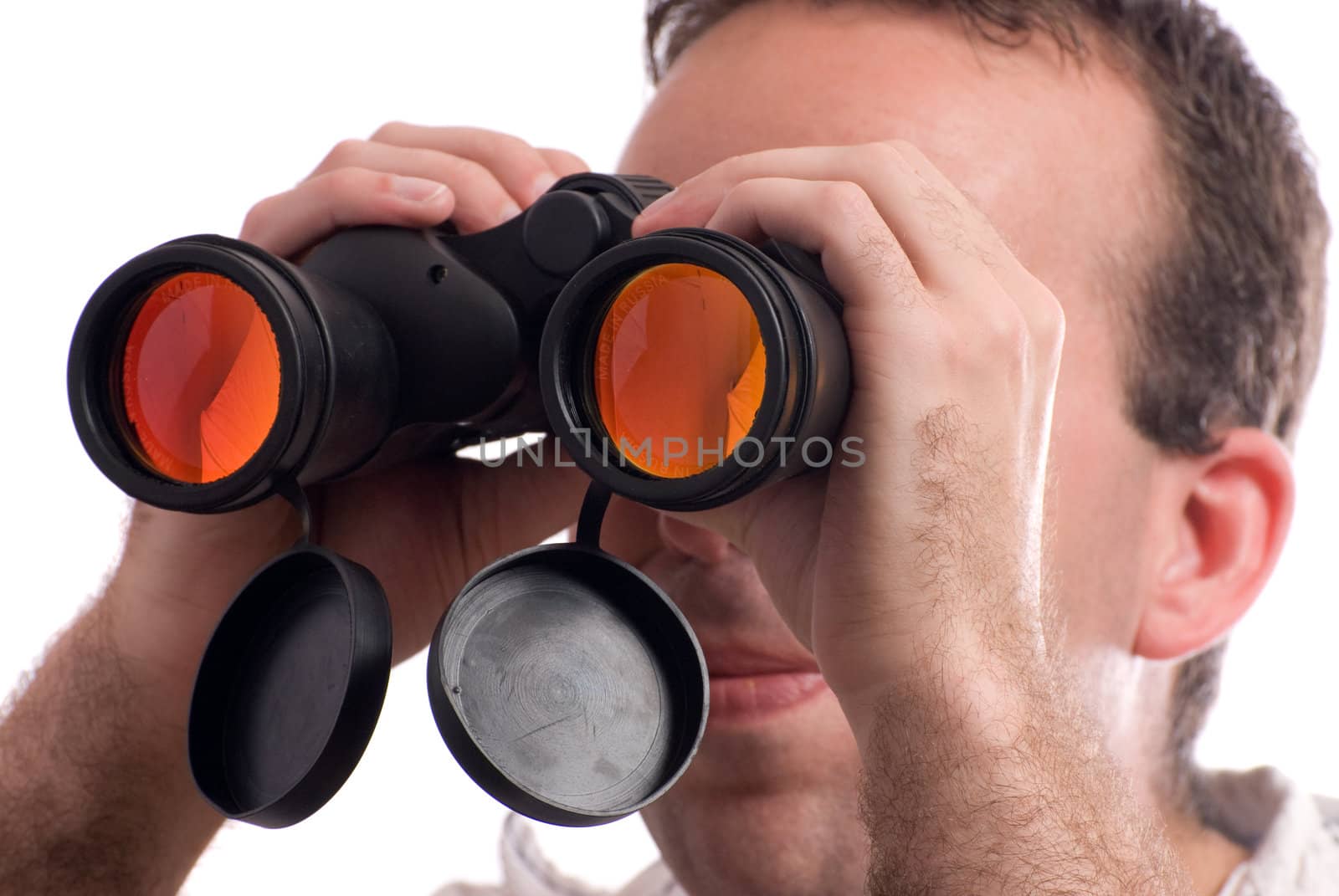Closeup view of a man spying with a set of binoculars, isolated against a white background