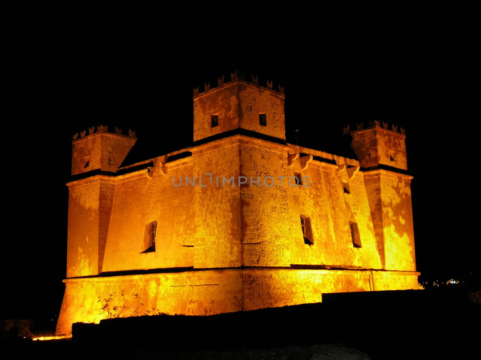 A view of The Red Tower of Mellieha in the night.