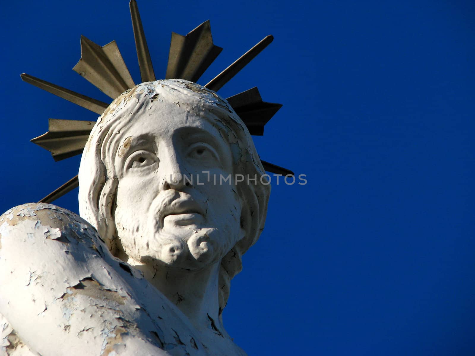 A detail of a stone statue portraying 'The Scourging of Christ' which is found on a hilltop in Siggiewi, Malta.