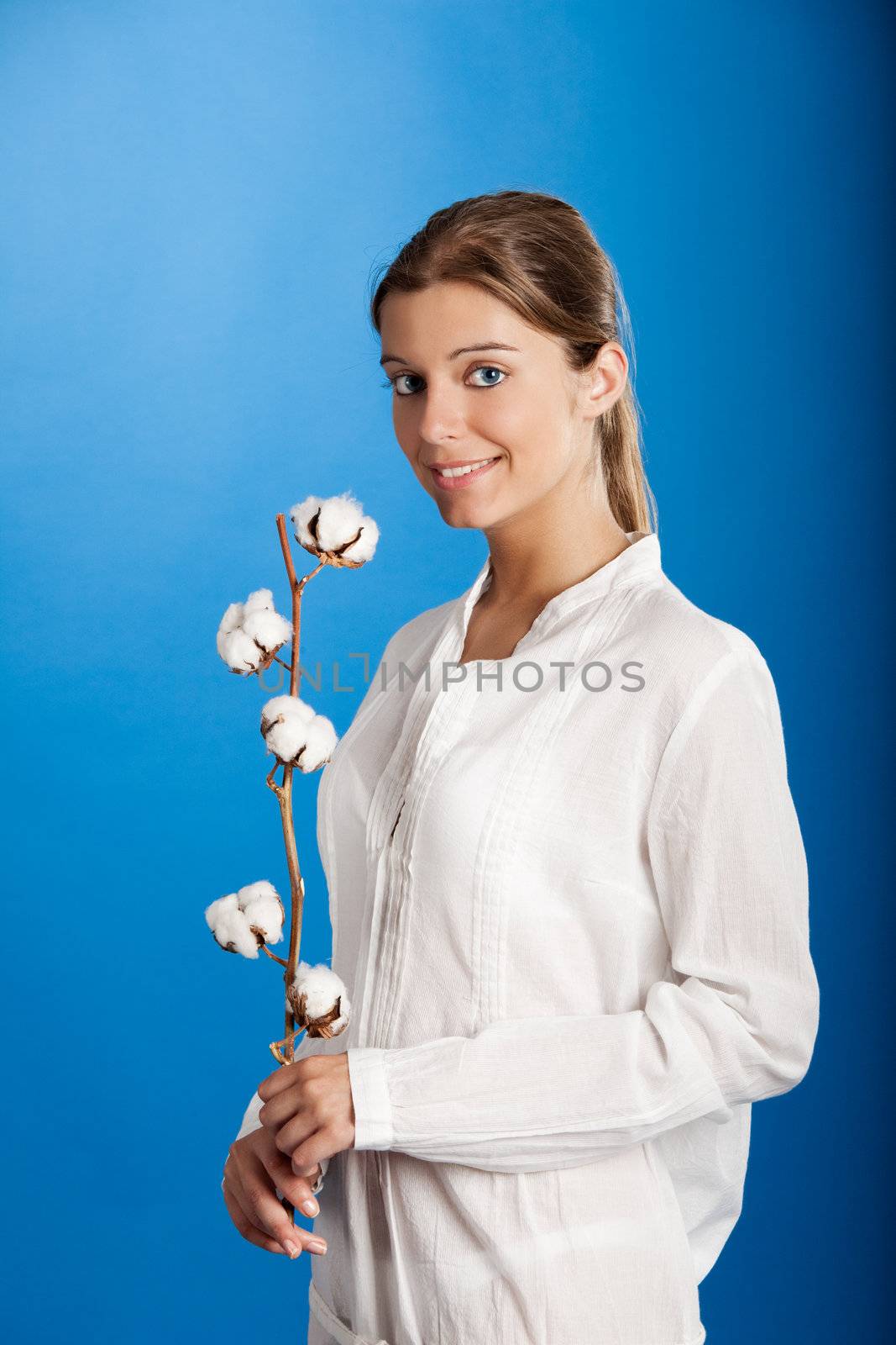 Portrait of a Fresh and Beautiful young woman holding a cotton plant