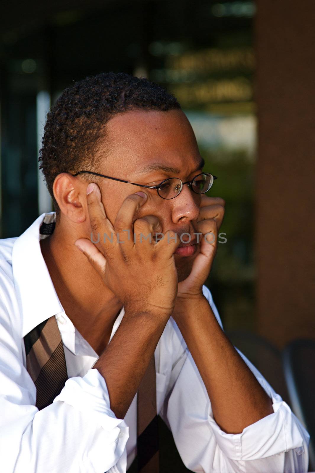 An confident and successful African-American businessman in a power suit