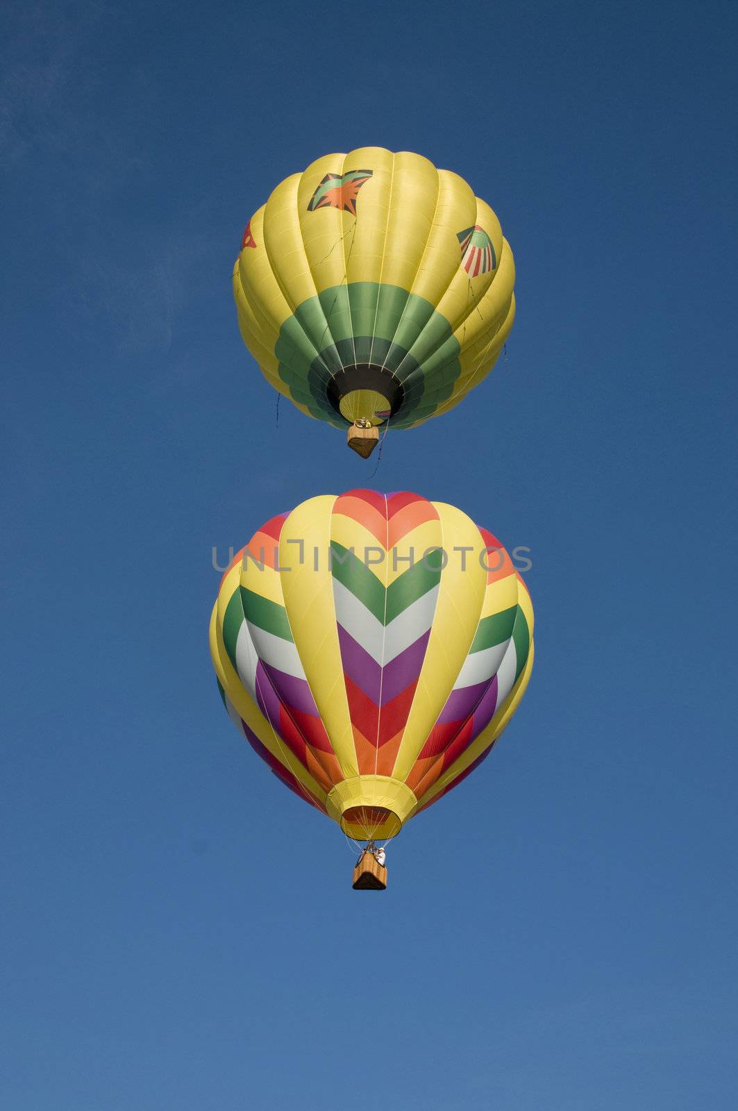 Hot-air balloon flying directly above another 