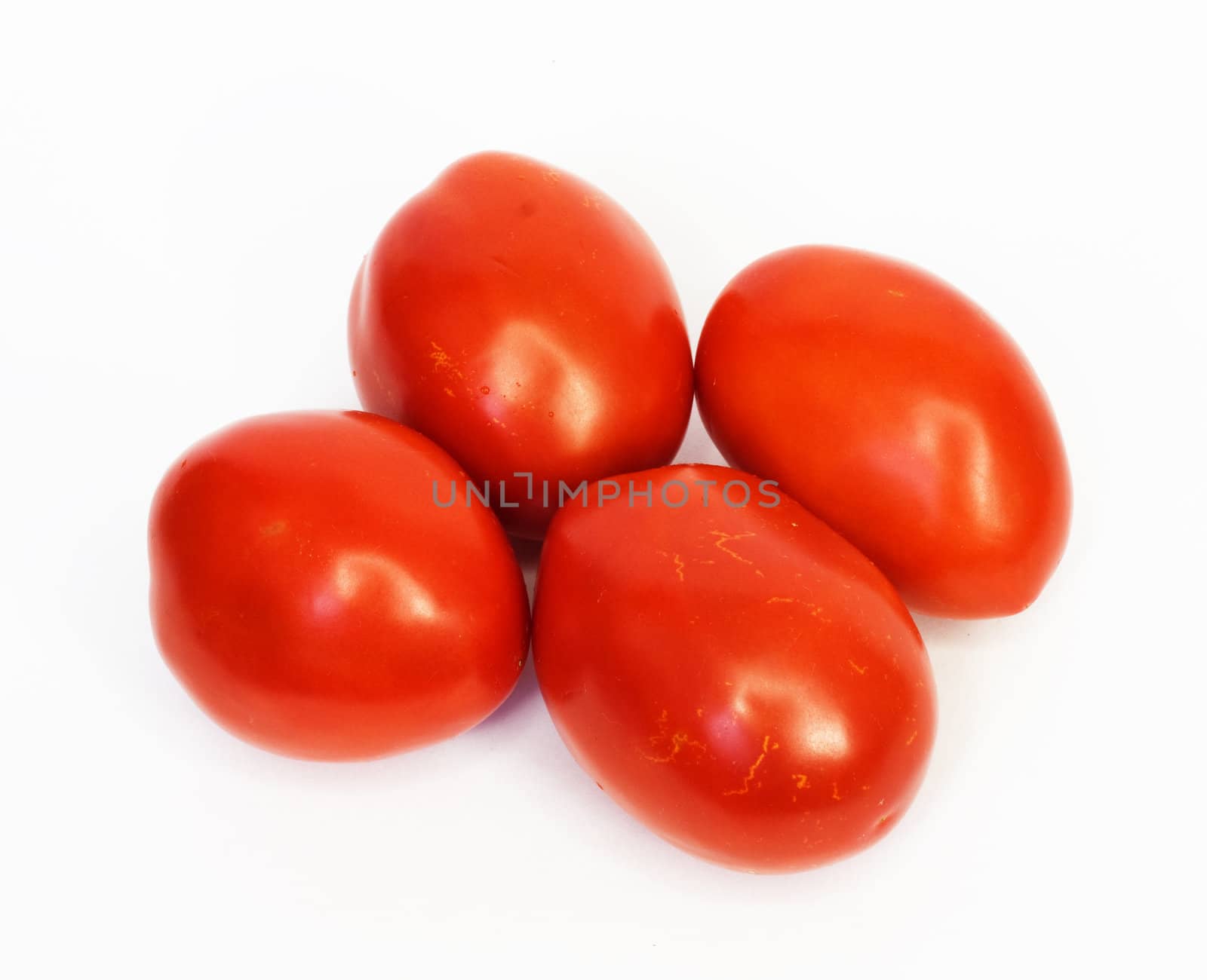 Four ripe tomatoes isolated on white background 