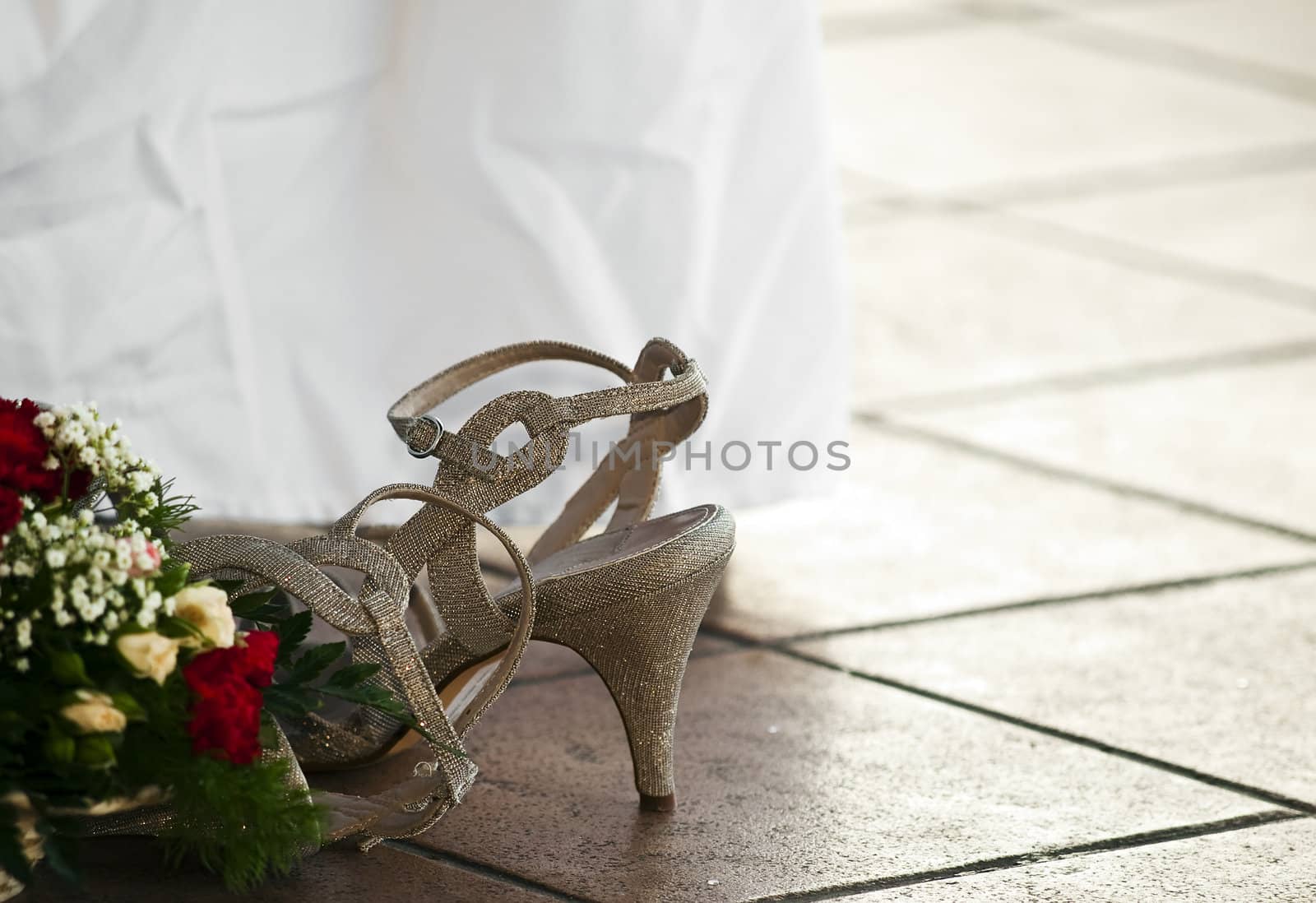 Detail and still life shot of bridesmaid's shoe lying on the floor
