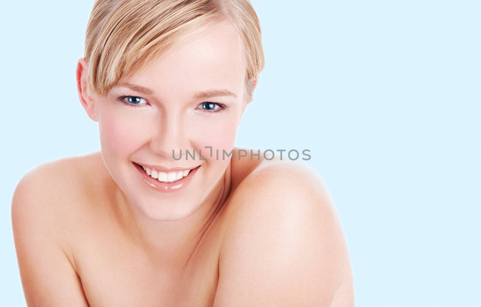 Closeup portrait of beautiful clean face of young woman