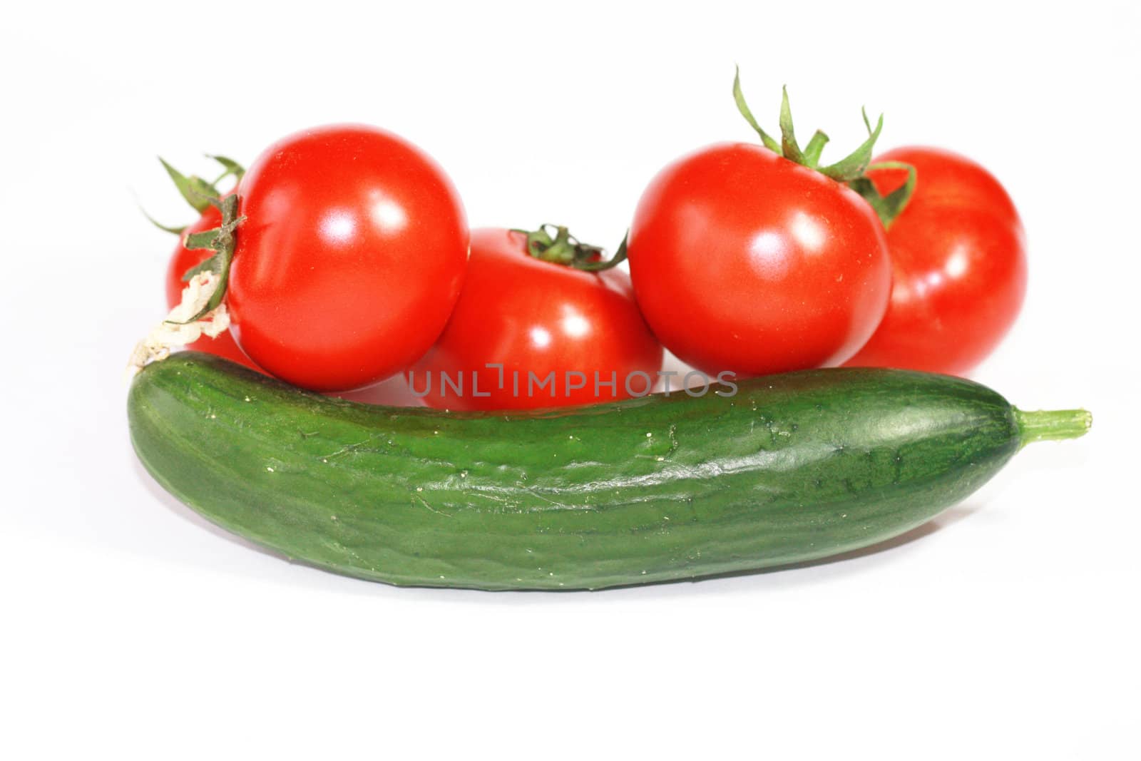 Fresh cucumber and tomatoes on white background