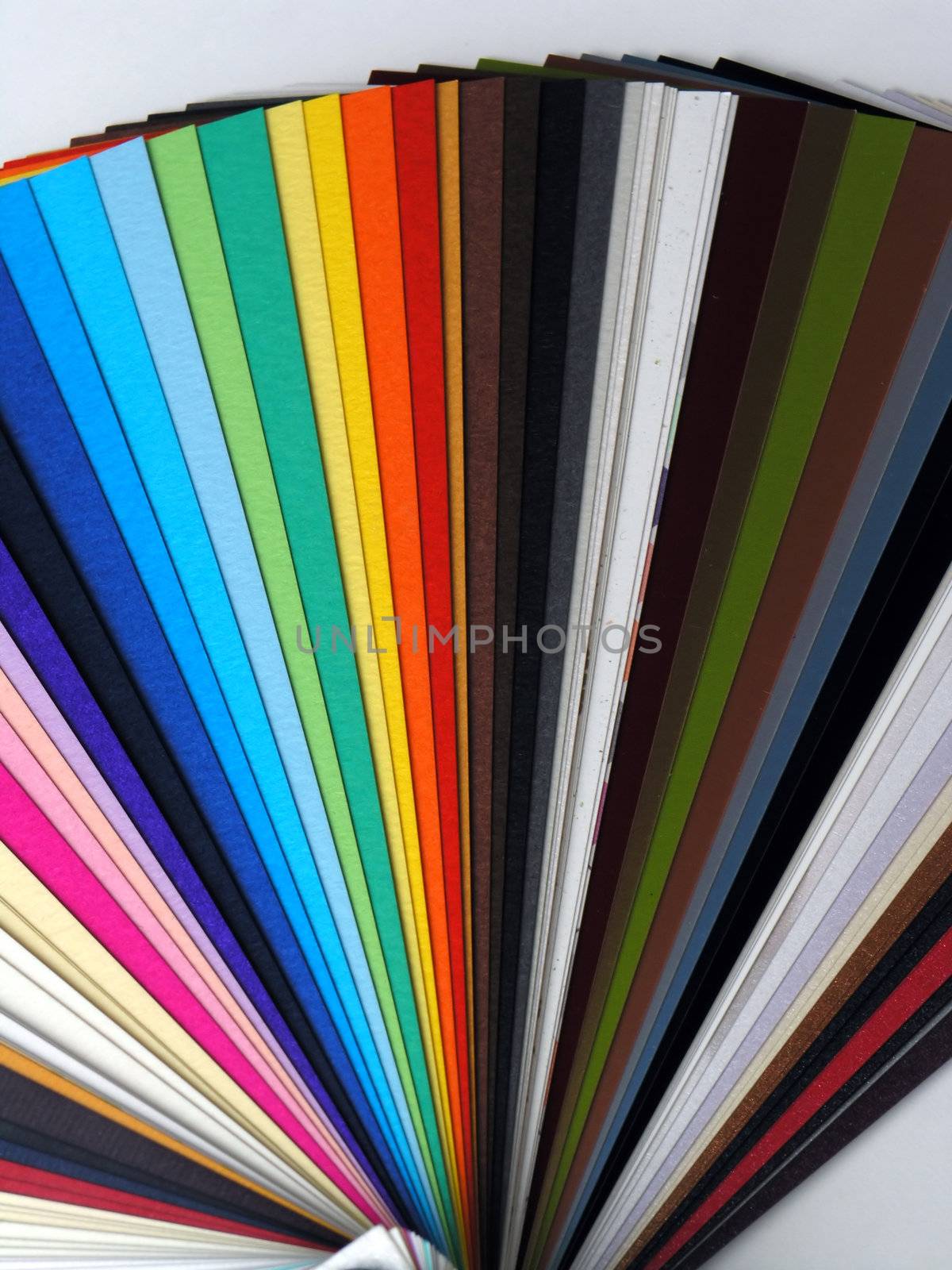 Colored samples of different papers on white background, business cards