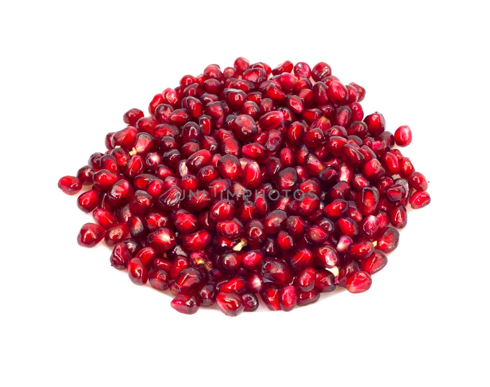 Extreme close up background of a red juicy ripe pomegranate fruit seeds 
