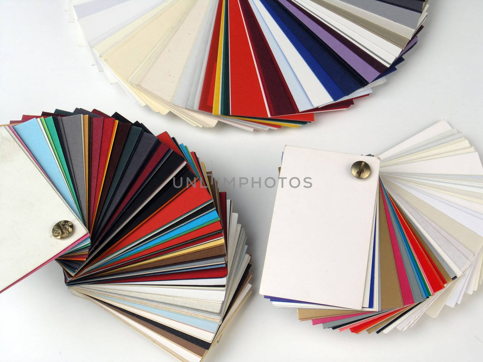 Colored samples of different papers on white background