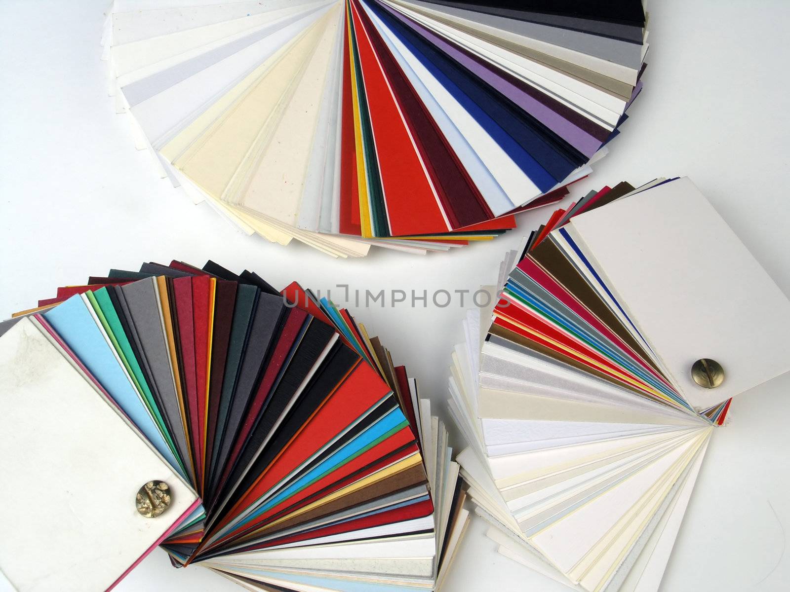 Colored samples of different papers on white background