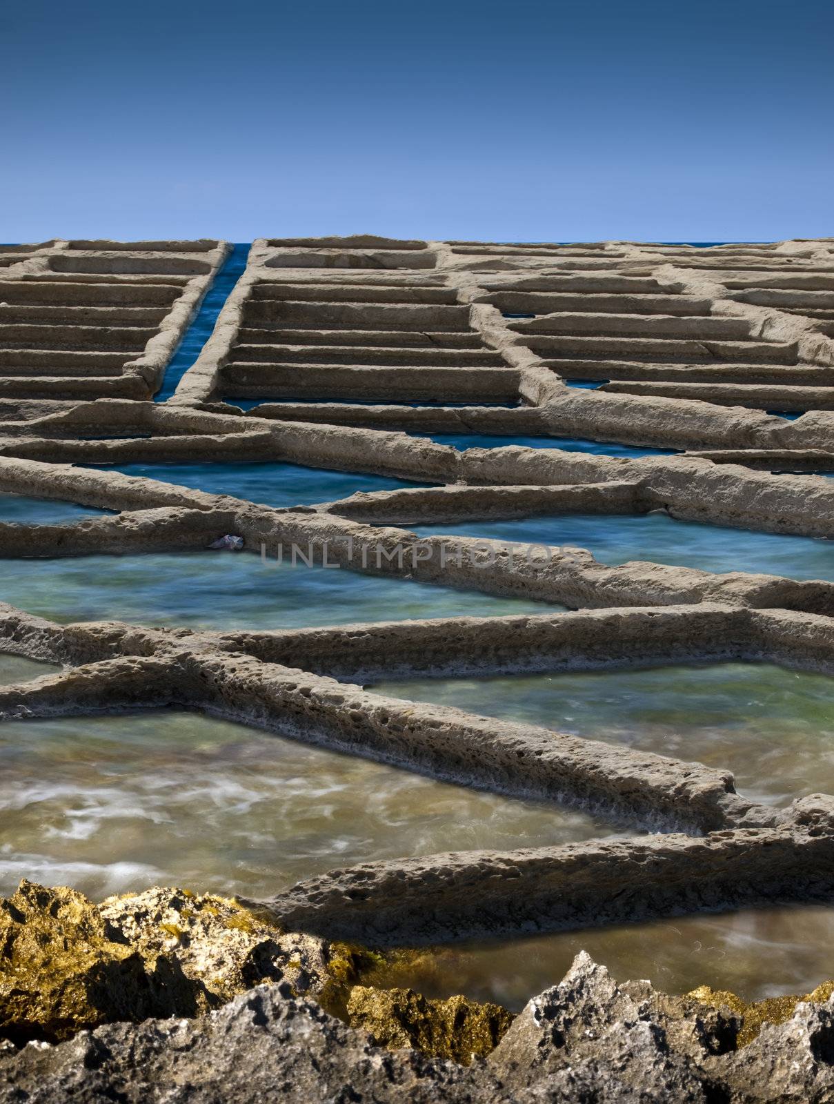 Ancient saltpanes from Roman times carved in sandstone