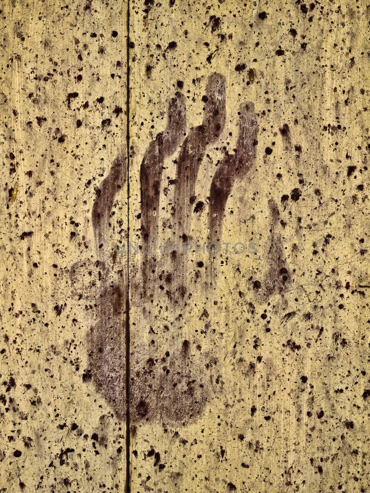 Eerie and spooky handprint on an old chapel door