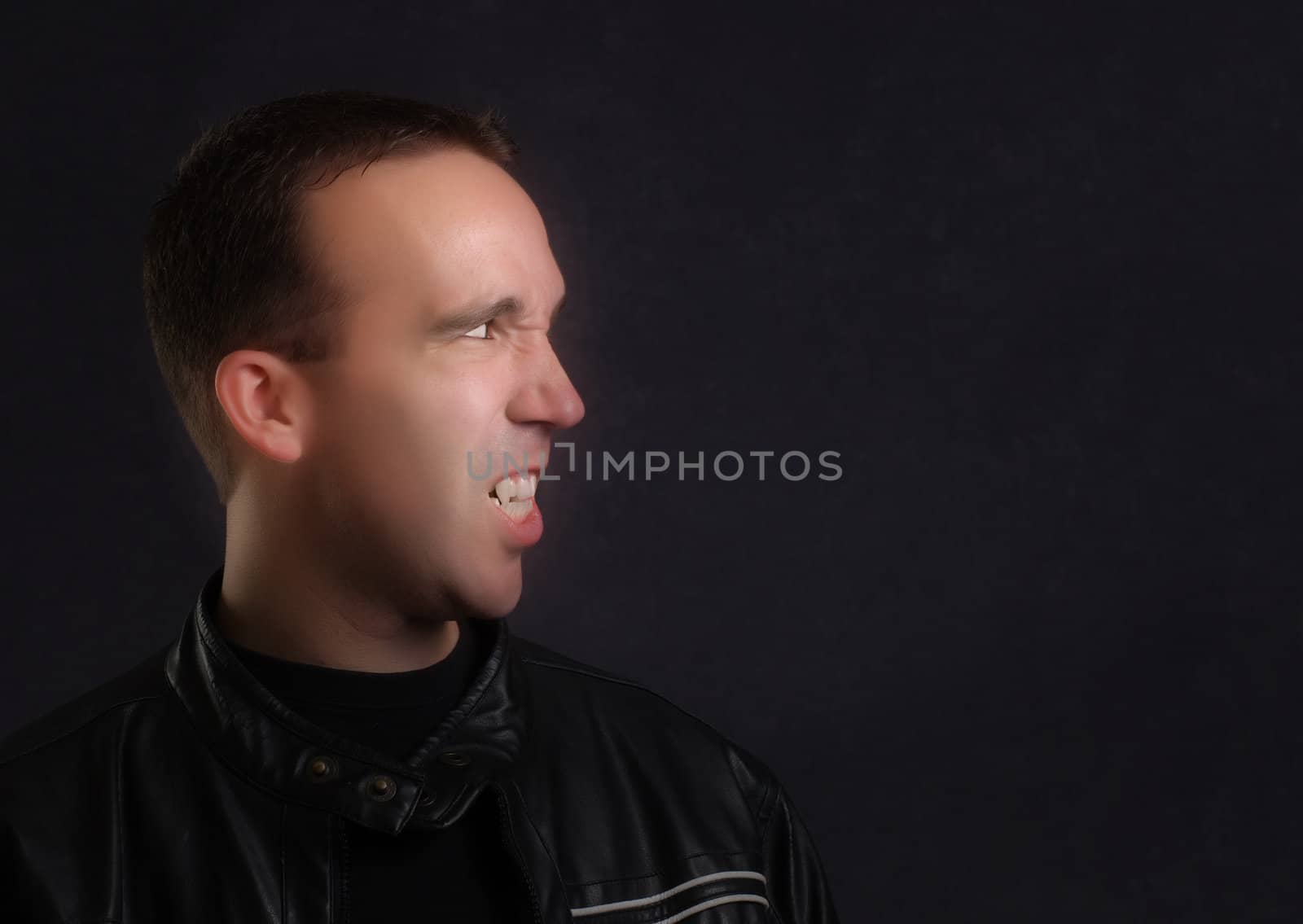 Profile view of a modern vampire wearing a leather jacket