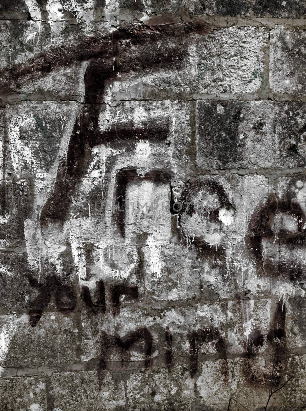 Graffiti and inscriptions on a limestone wall shot in HDR