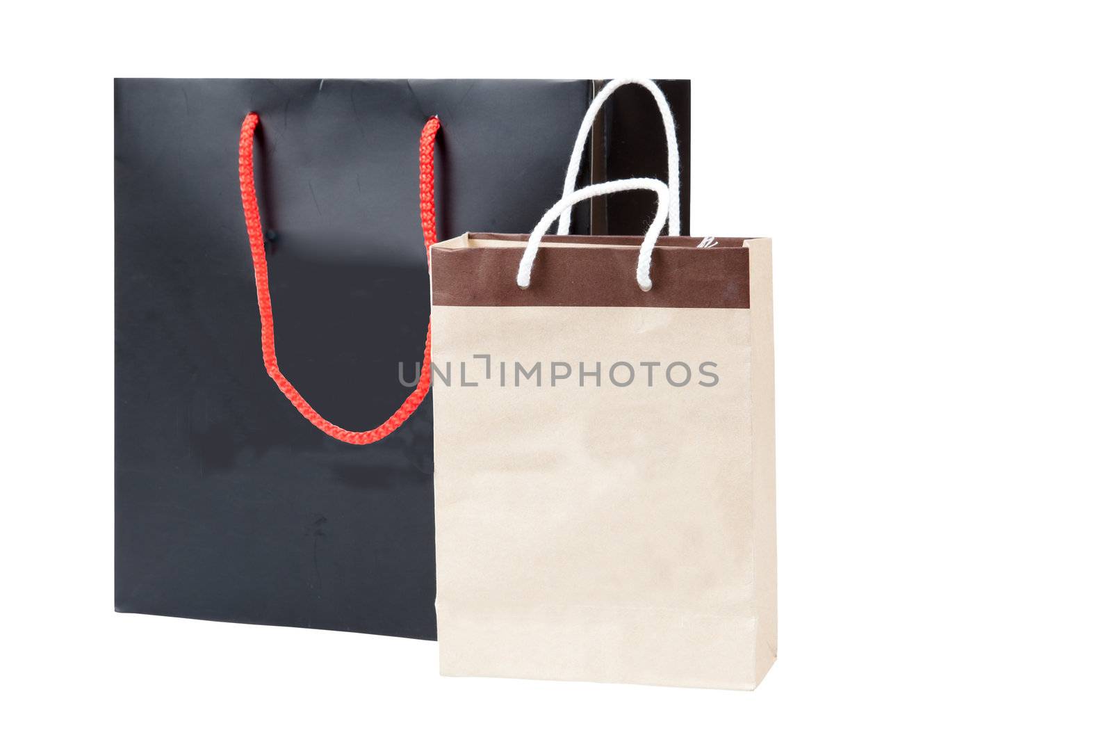 Small brown bag and black shopping bag, isolated on white backgr by FrameAngel