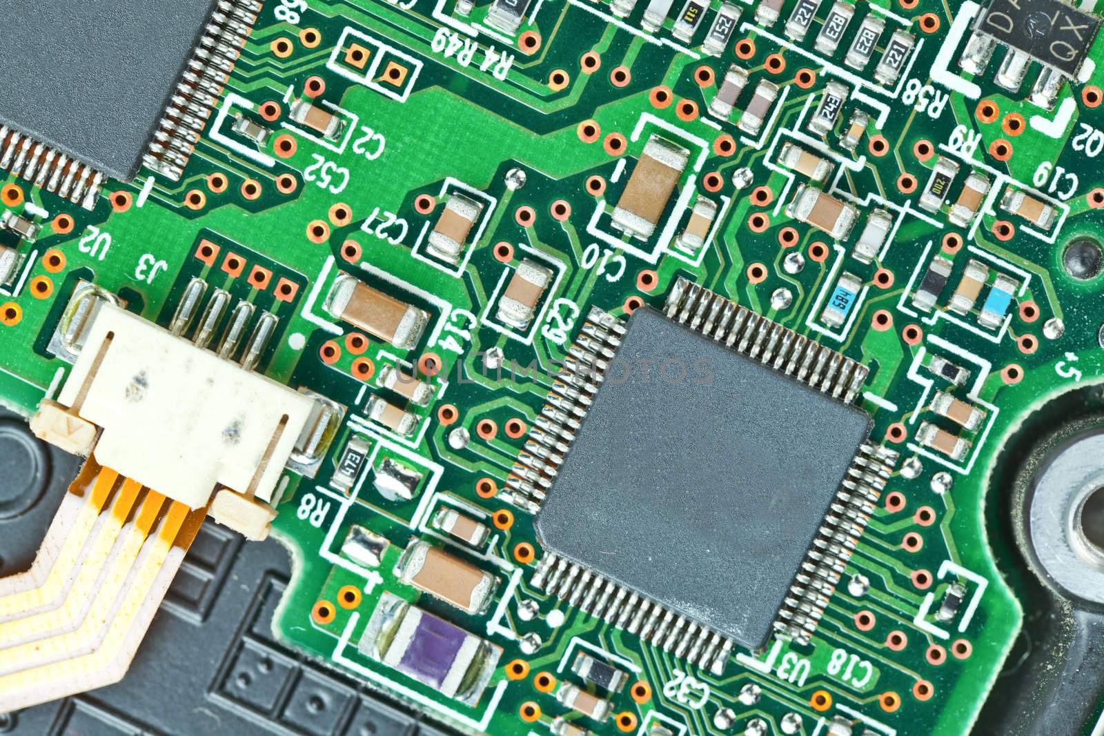 The modern printed-circuit board with electronic components macro background