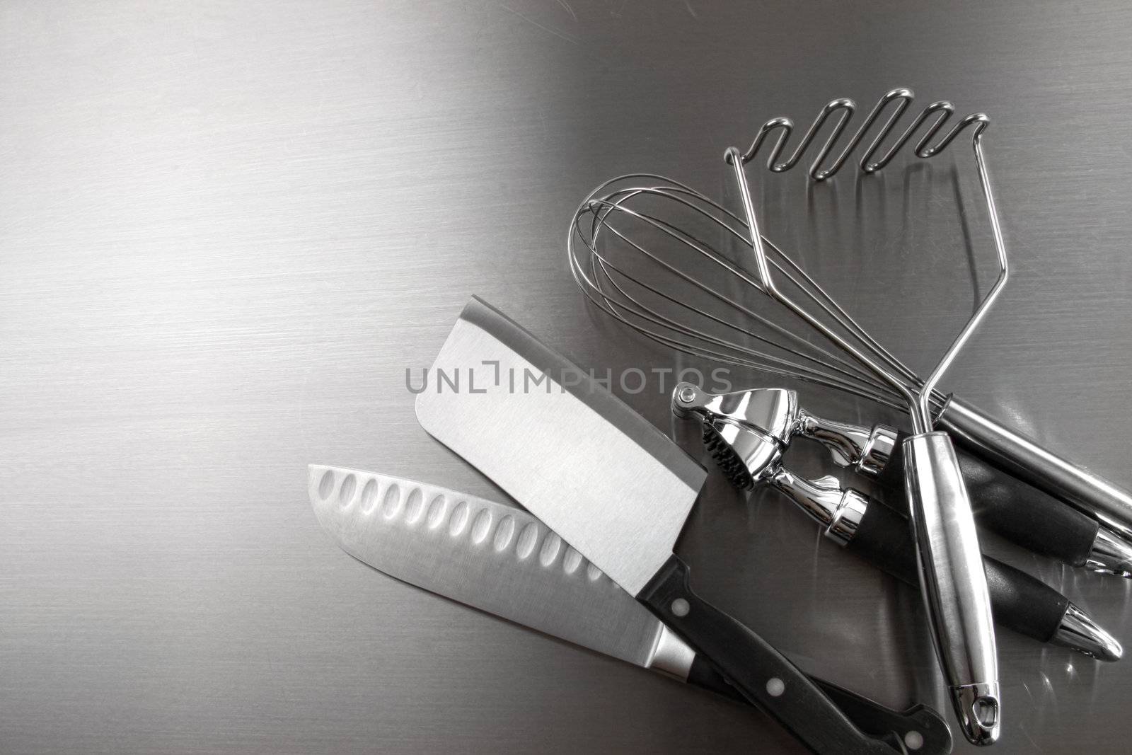 Kitchen utensils on stainless steel
