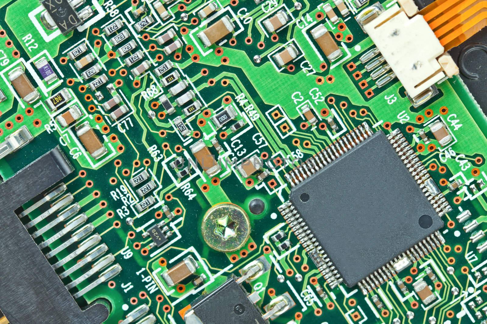 The modern printed-circuit board with electronic components macr by FrameAngel