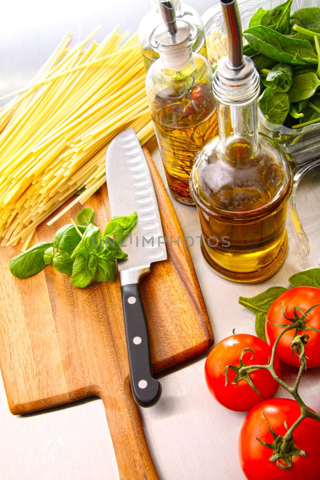 Preparation for making fettuccine with tomato sauce and basil 