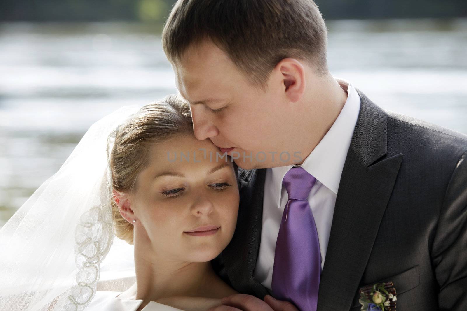 Newly-married couple in park