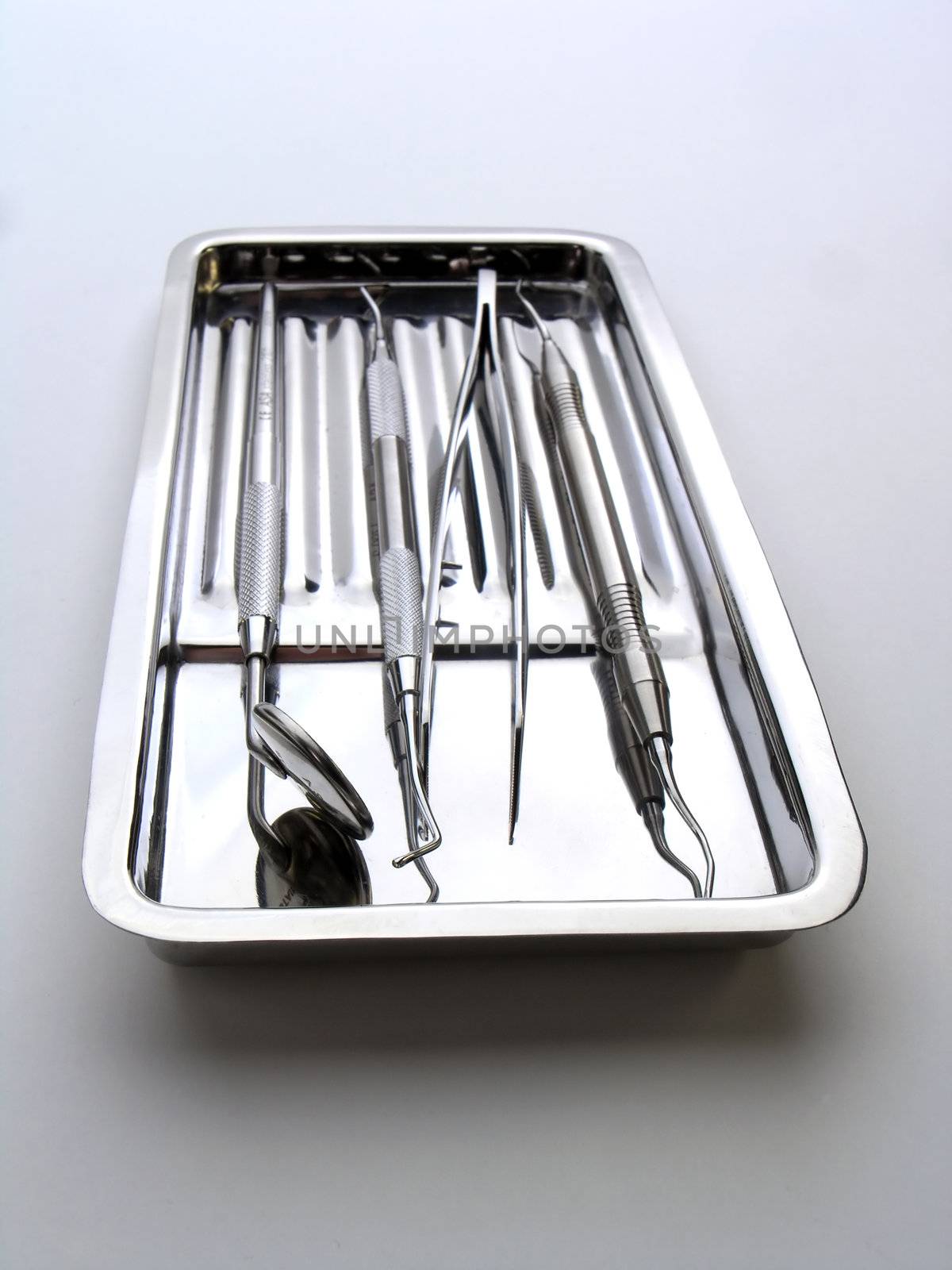 Close-up Dental Instruments on white background, metal, iron, steel, mirror
