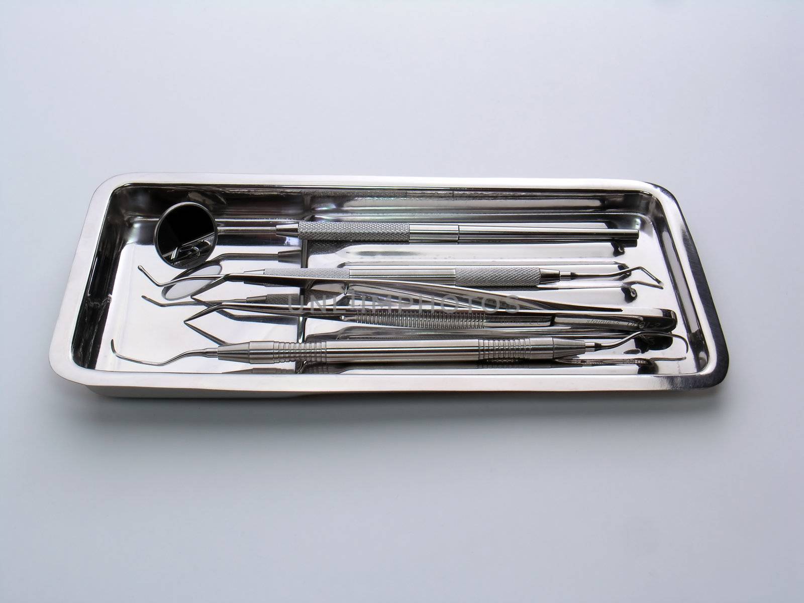 Close-up Dental Instruments on white background, metal, iron, steel, mirror
