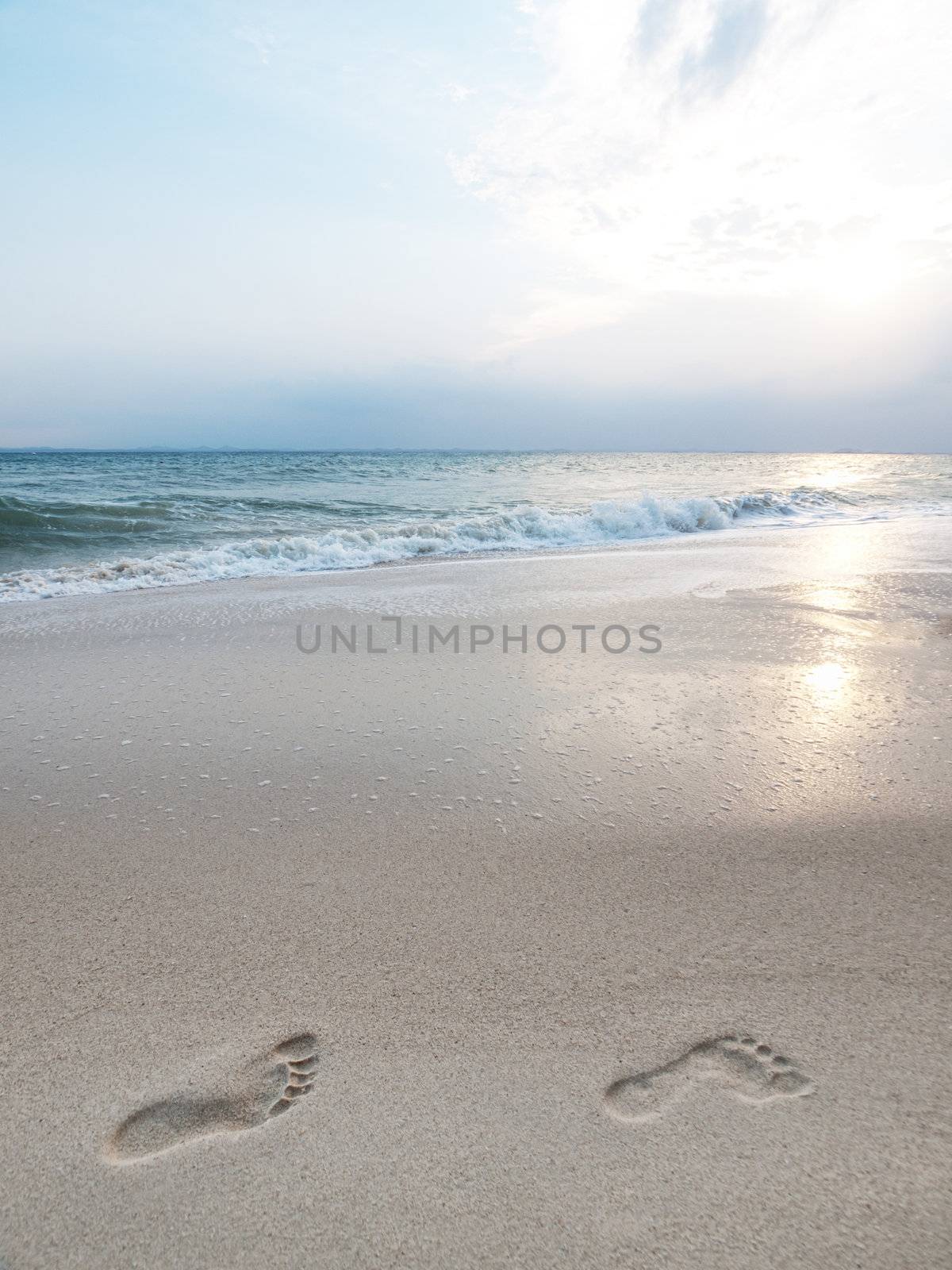 Footprints on the sandy shore in an island in Malaysia