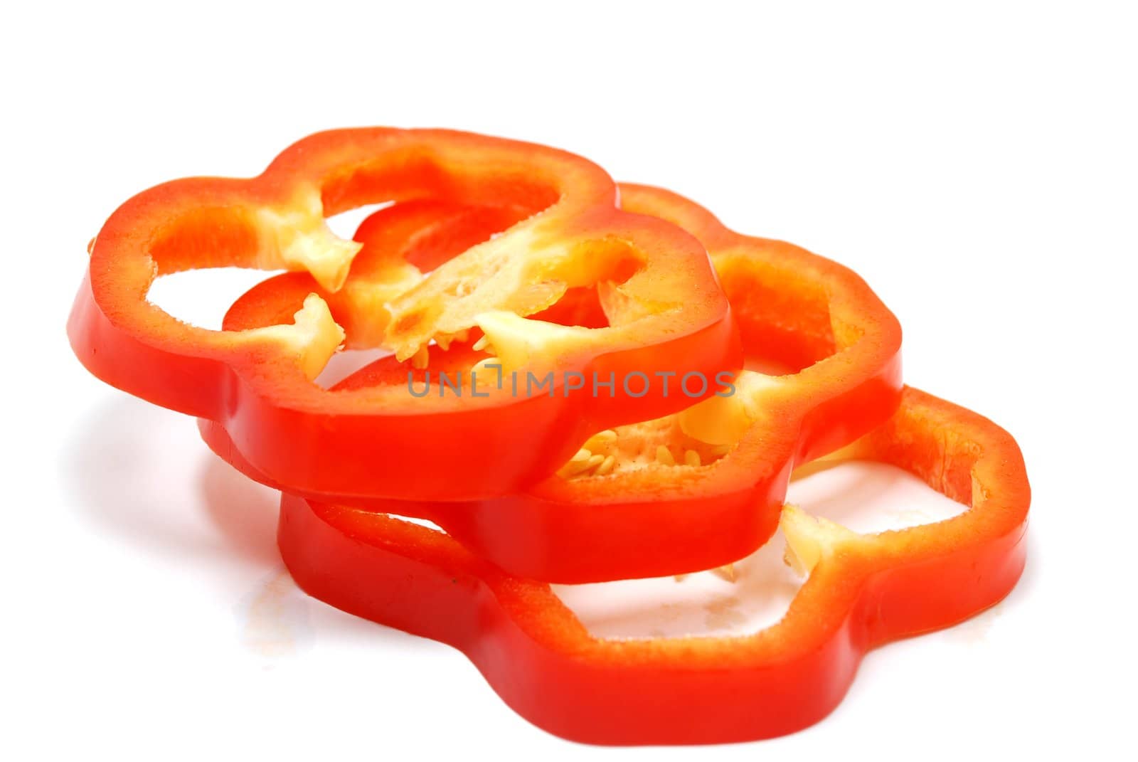 Isolated Sliced Red Pepper on White Background