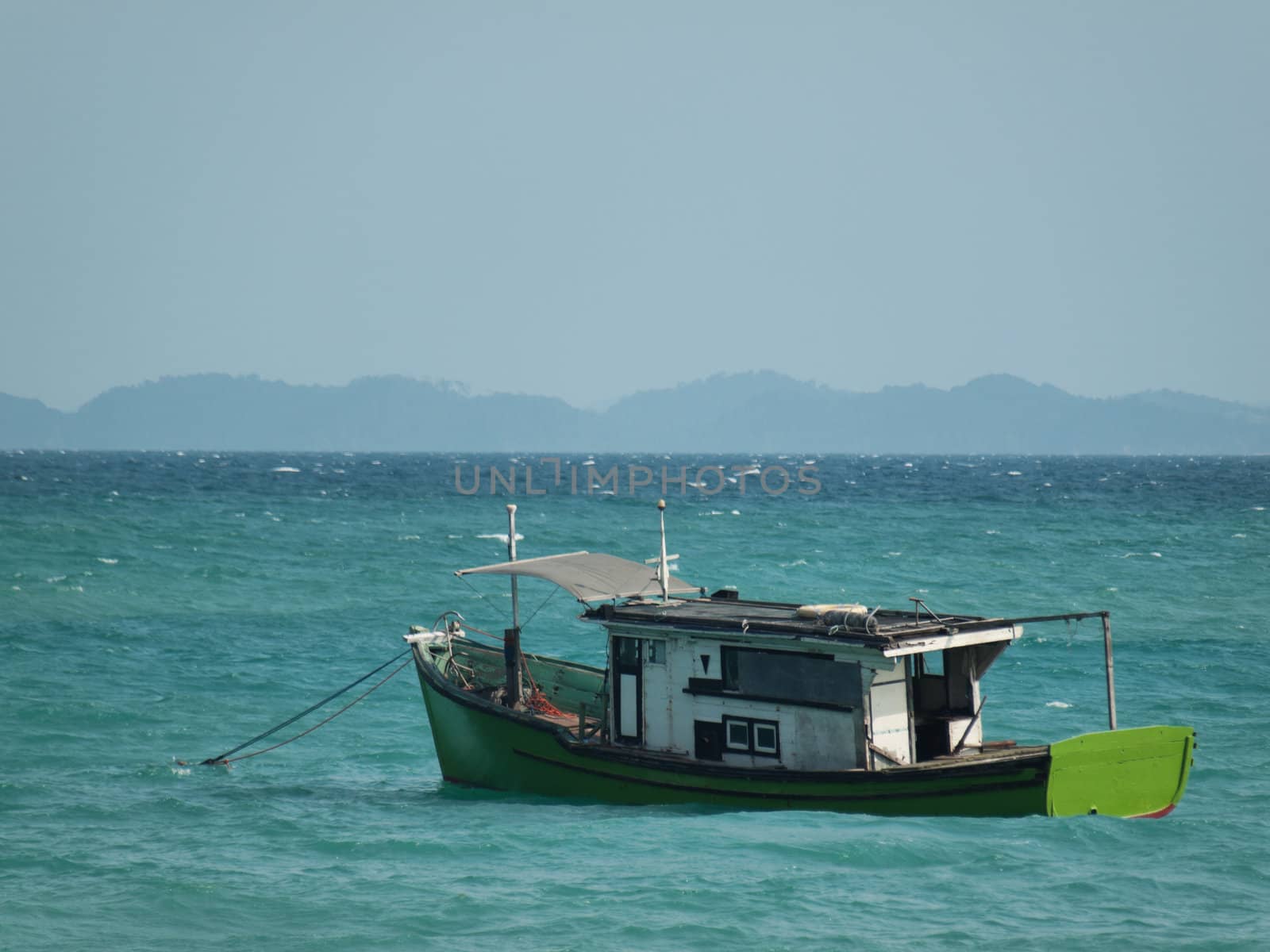 Colorful boat anchored in the South China sea in Malaysia