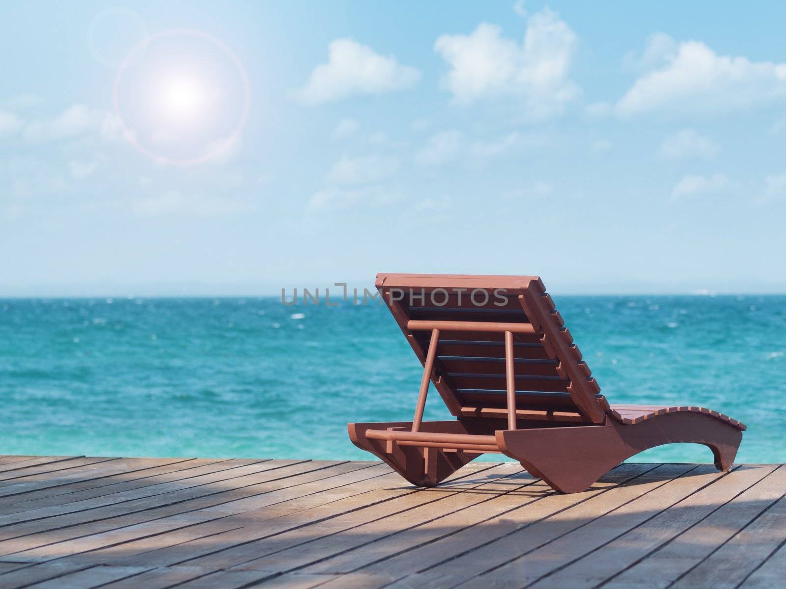 Empty beach chair at a resort facing the south China sea in Pulau Besar Malaysia