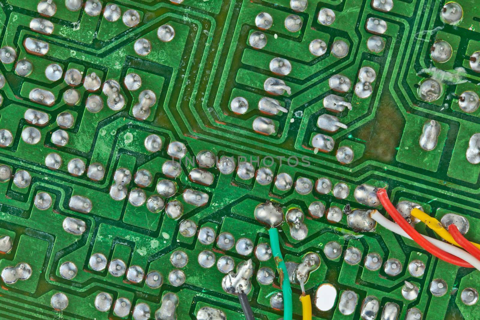 The printed-circuit board with electronic components macro background