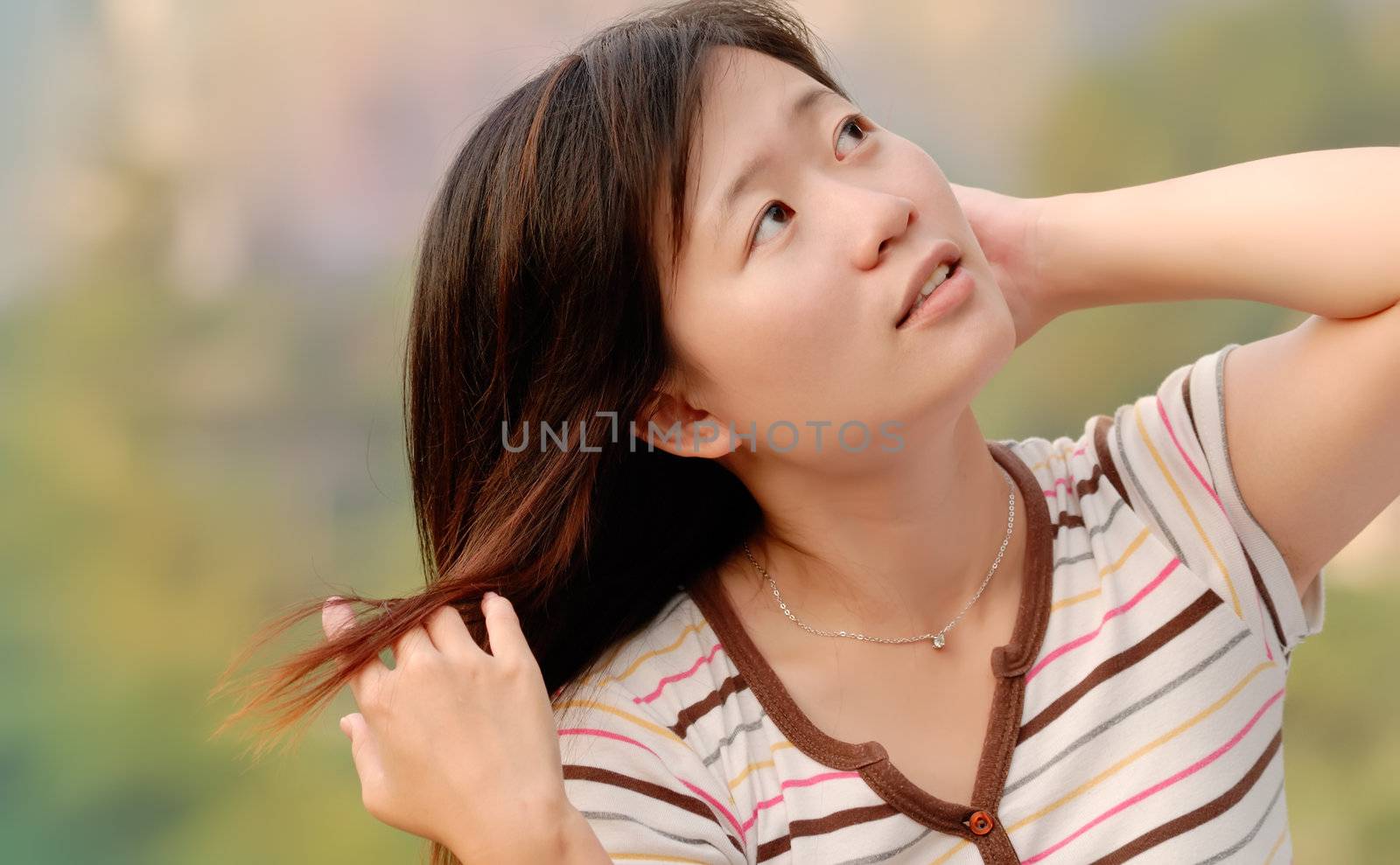Here is an Asian beautiful girl in the outdoor.