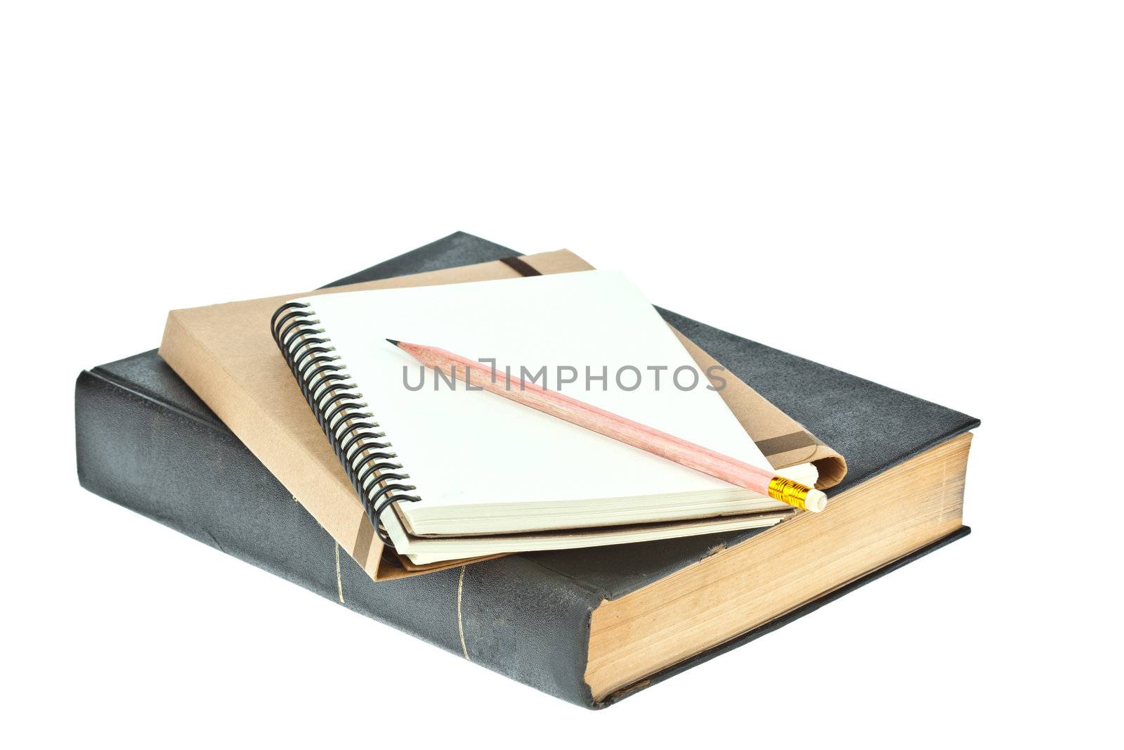 Pencil on Light cream color paper note book on brown book