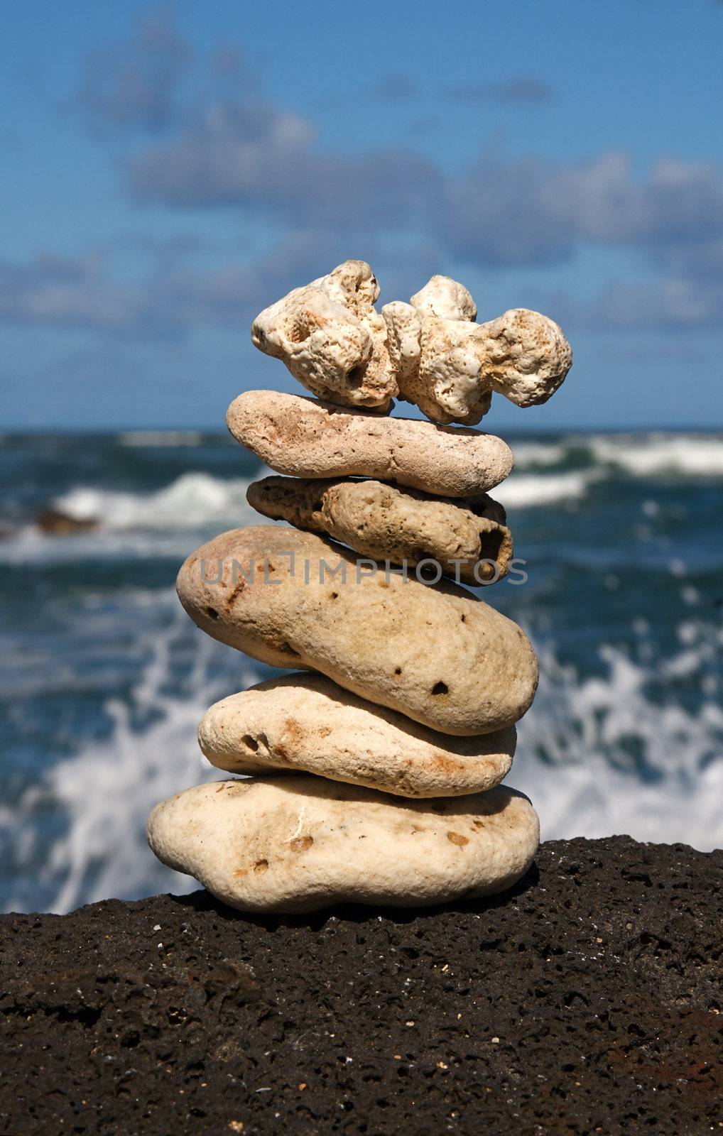 White coral rocks stacked by a meditating zen follower