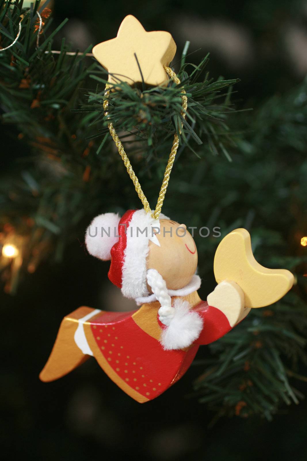 Christmas angel hanging on a Christmas tree