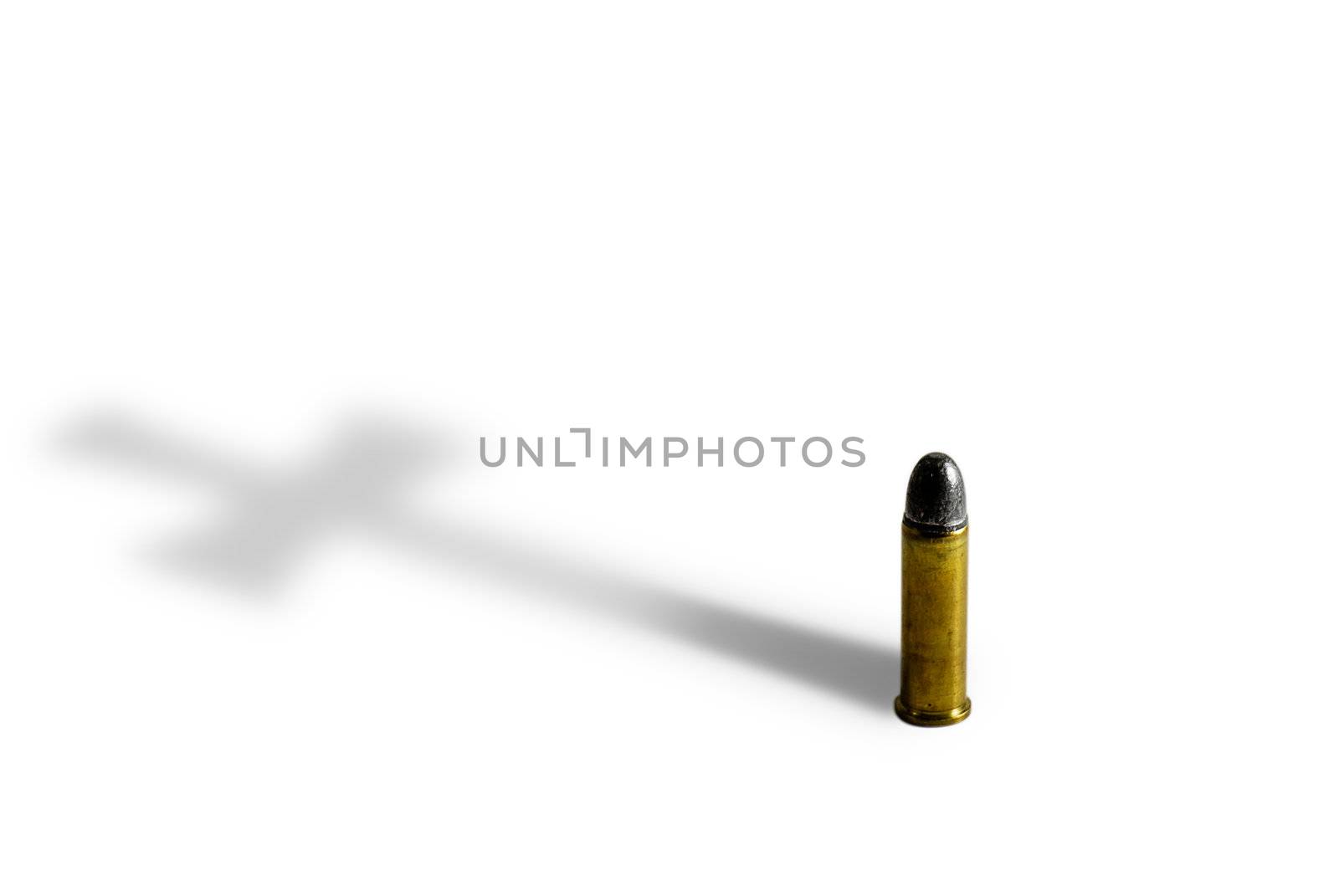 Pistol bullet casting cross shadow. Isolated on white.