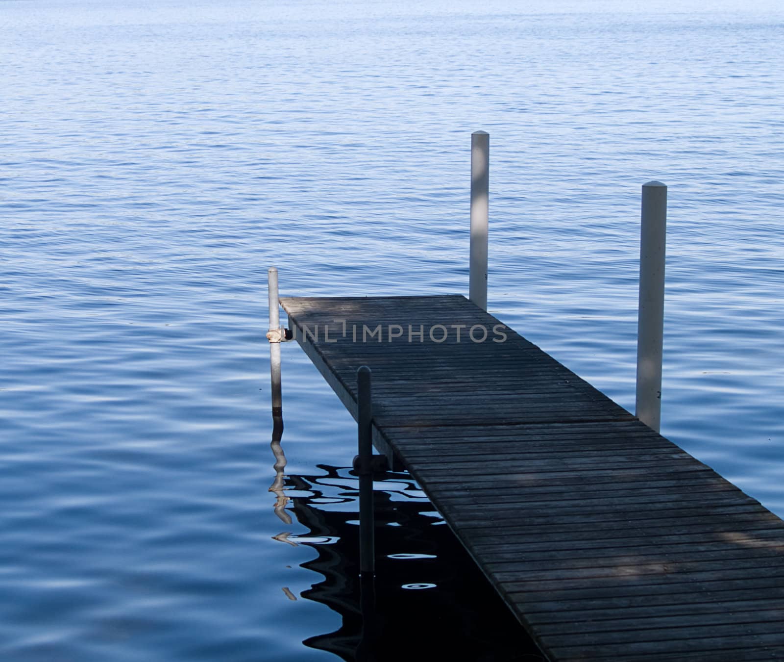 Taken in the morning, a pier allowing access to a lake.
