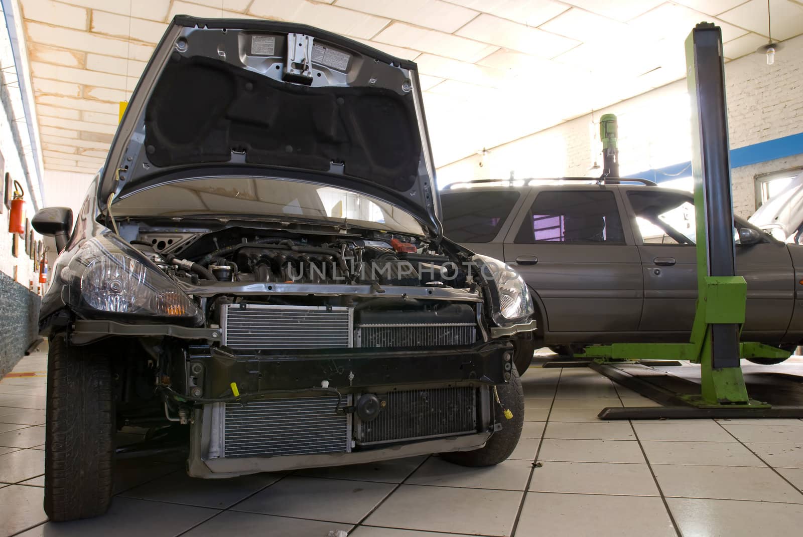 Low profile front shot of a black modern car