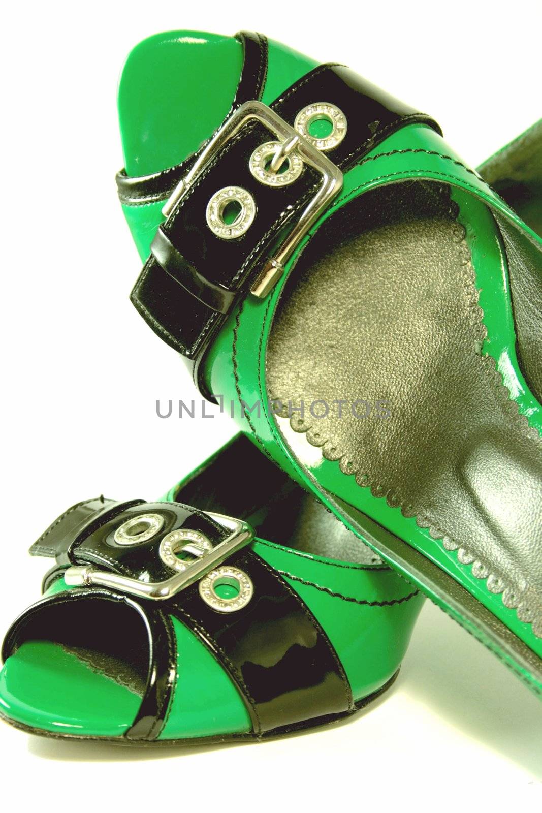 Green High-Heeled Shoes Close-up on white background. Series