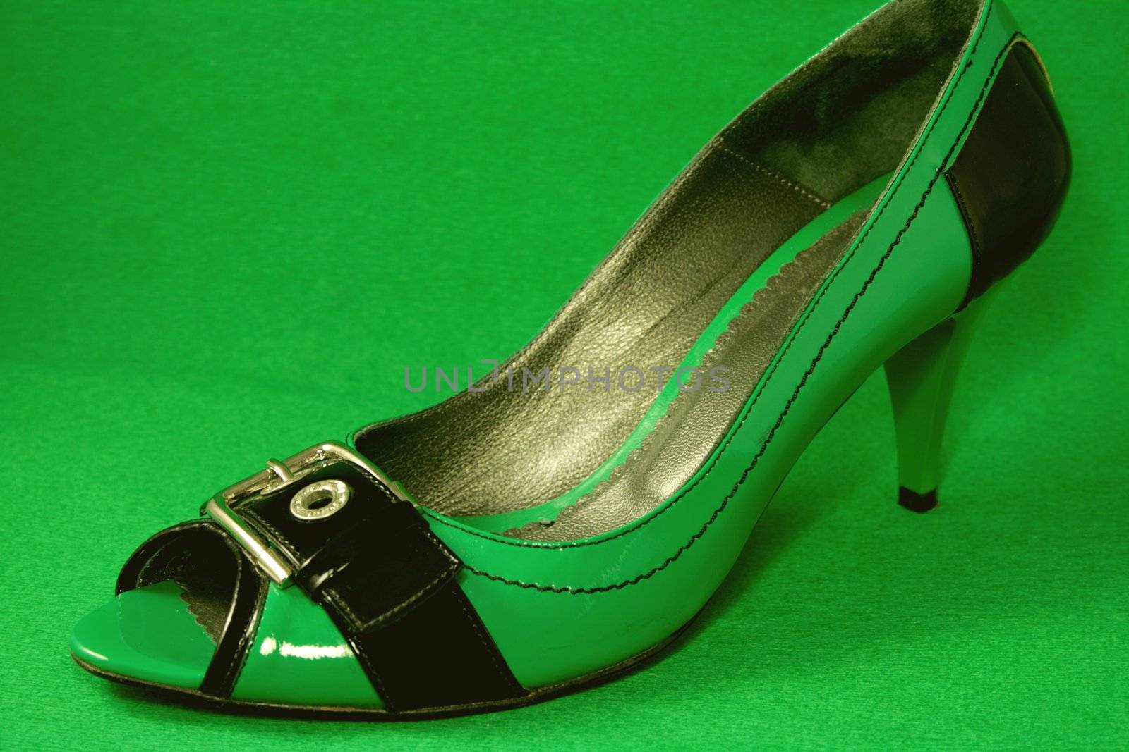 Green High-Heeled Shoes on Green Background by kinkydi