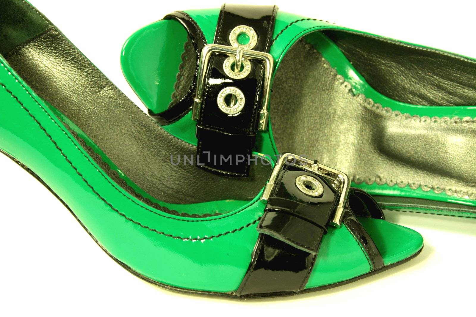 Green High-Heeled Shoes Close-up on white background. Series
