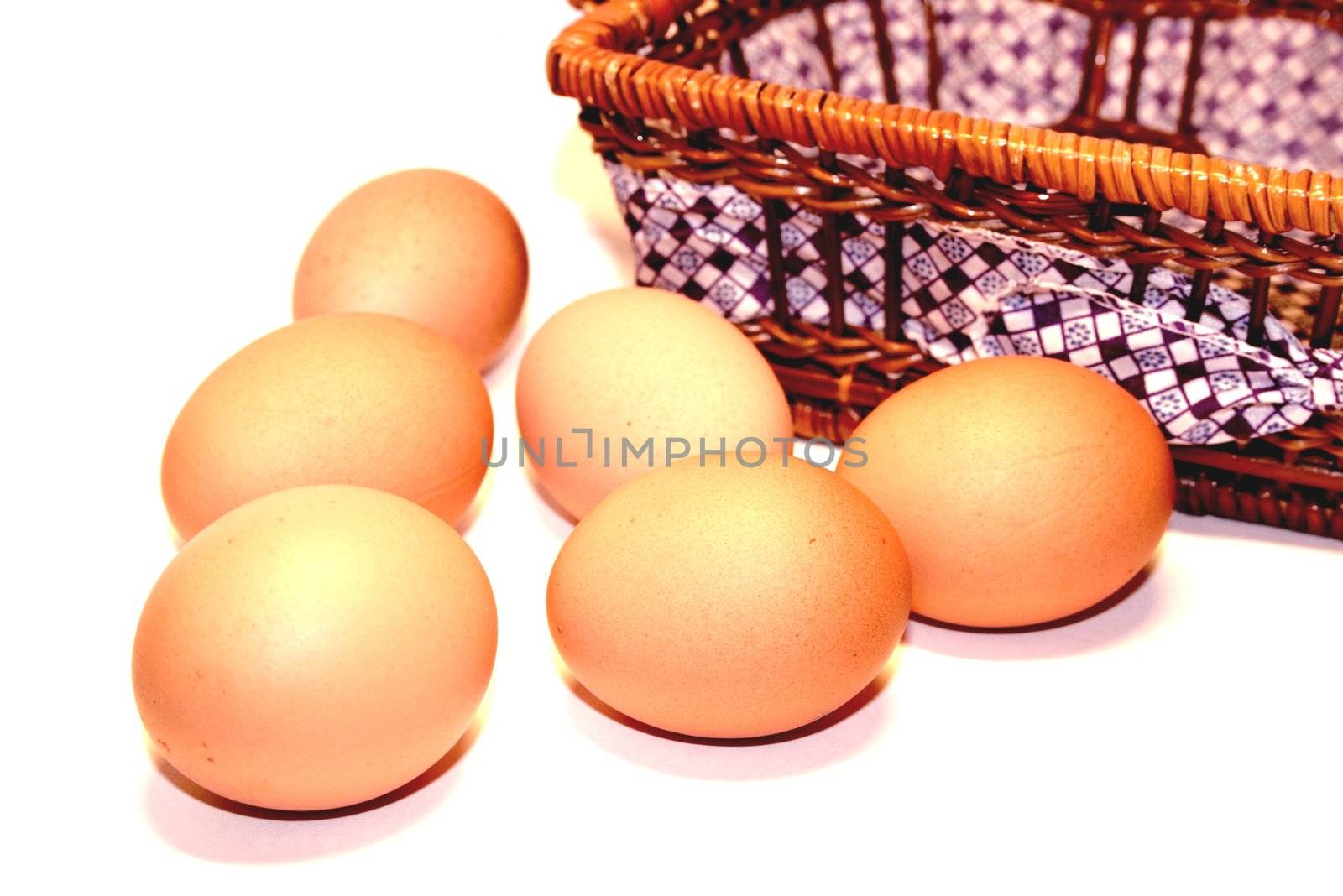 Brown Eggs Near Straw Basket by kinkydi