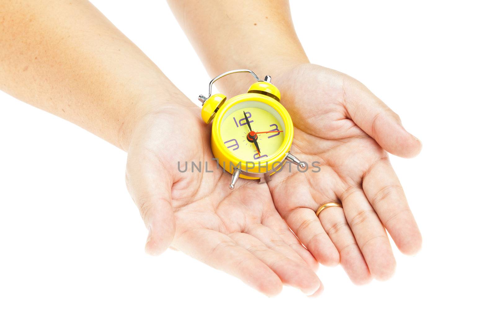 Clock on hand as time management concept