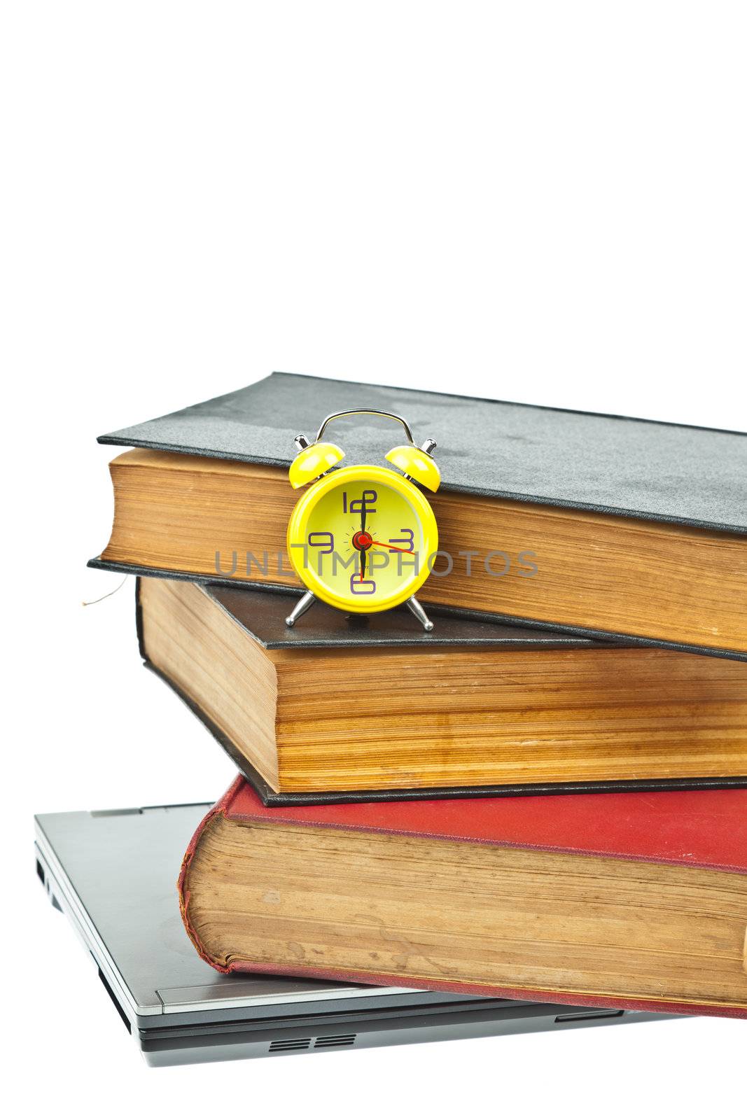 Clock on book as time management concept by FrameAngel