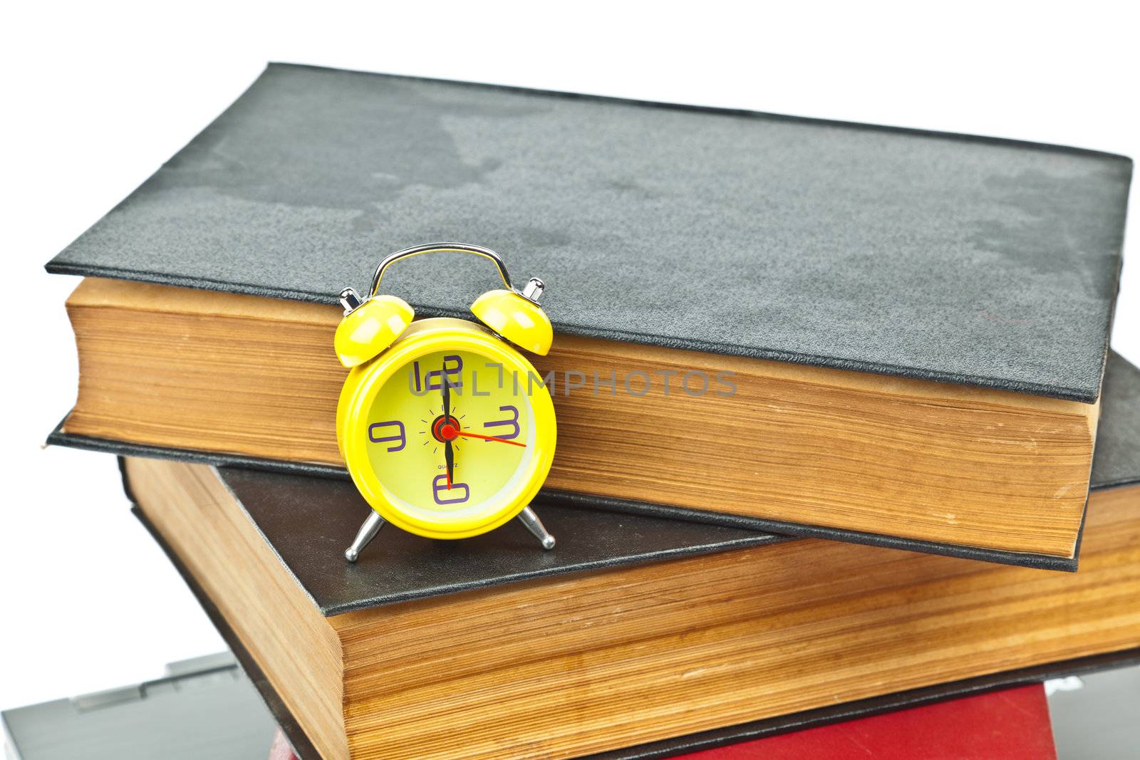 Clock on book as time management concept by FrameAngel