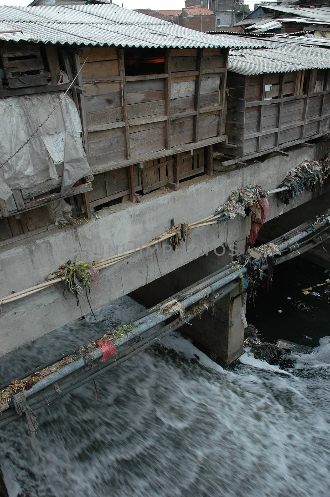 portrait of slum area below pasupati bridge in bandung