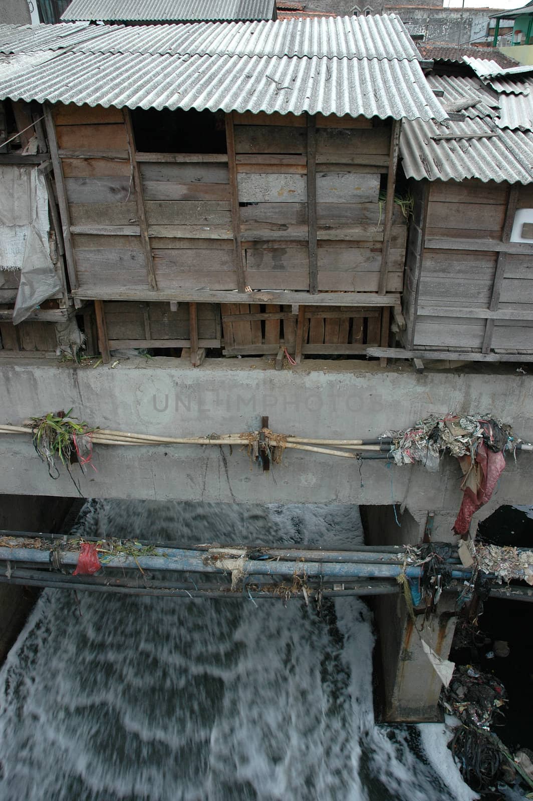 portrait of slum area below pasupati bridge in bandung