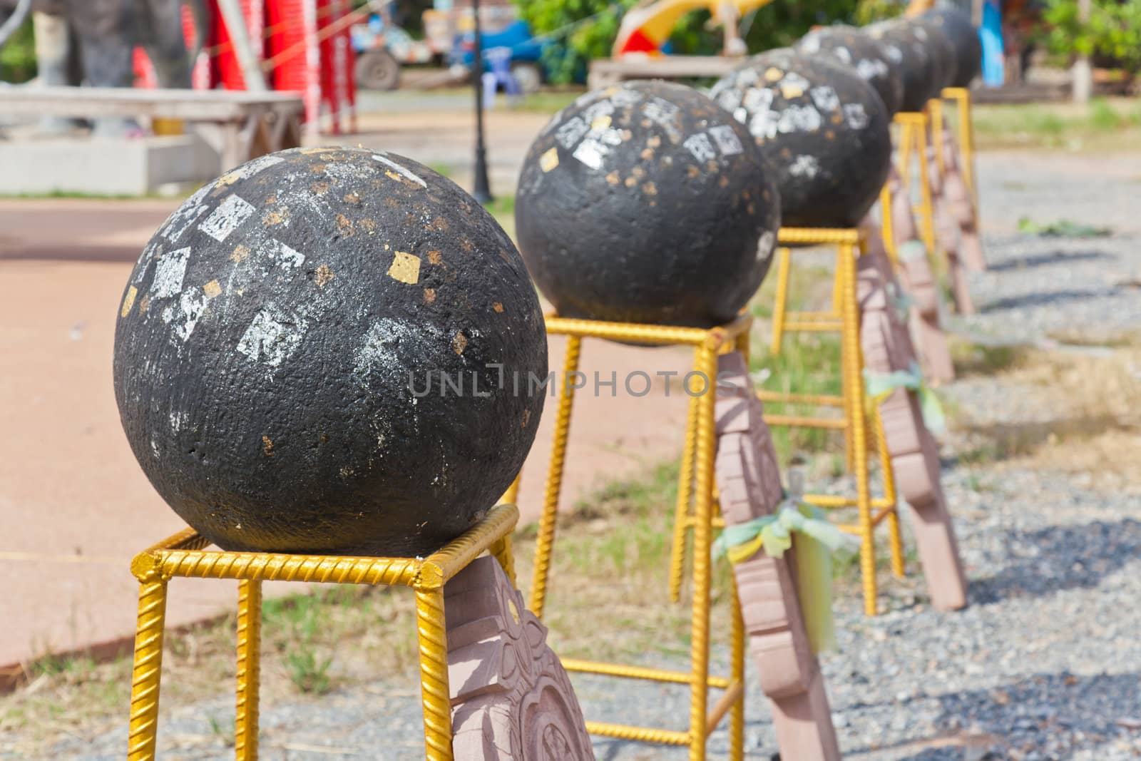 Thai culture; Loknimit-black stone and golden plate at Thailand  by FrameAngel